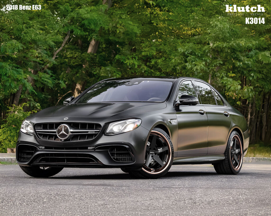 2018 Mercedes-Benz E63 AMG on Klutch K3014 3-piece forged wheels – satin black sedan with deep lip modular 5-spoke design in wooded backdrop