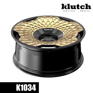 Low-angle rendering of the gold and black Klutch K1034 forged wheel showing recessed surface detailing and face depth