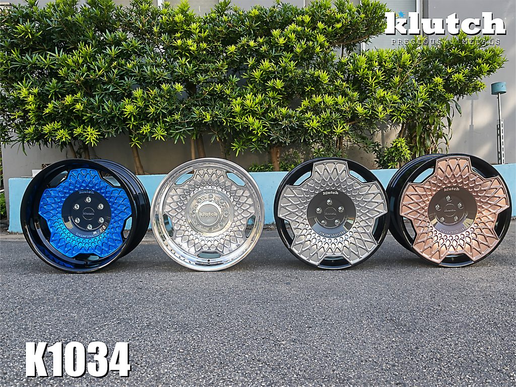 Four Klutch K1034 wheels displayed side by side in blue, polished, black with polished face, and rose-gold finishes