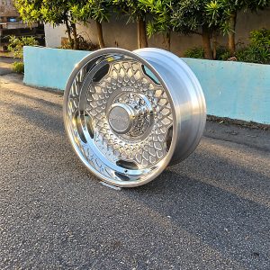 Polished Klutch K1034 forged wheel showing its geometric face from a front three-quarter angle