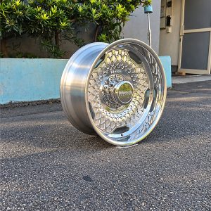 Angled view of the polished Klutch K1034 forged wheel showing the patterned face and barrel
