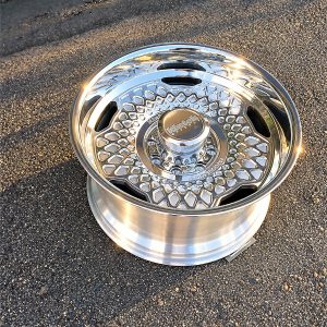 Top view of the polished Klutch K1034 forged wheel showing geometric surface detailing in natural light