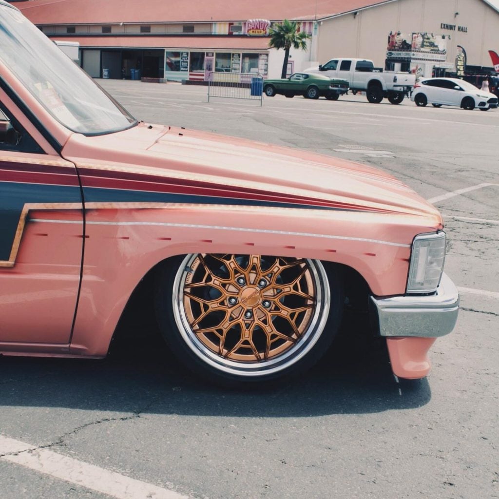 Close-up of a copper-toned Klutch K3020 wheel with polished outer lip on a pink Toyota pickup