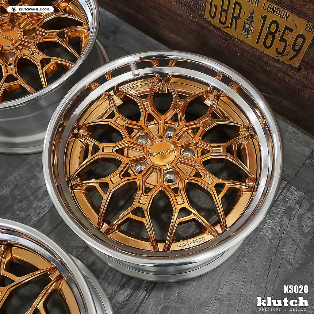 Close view of a Klutch K3020 wheel showing its layered copper-toned spokes and polished outer lip